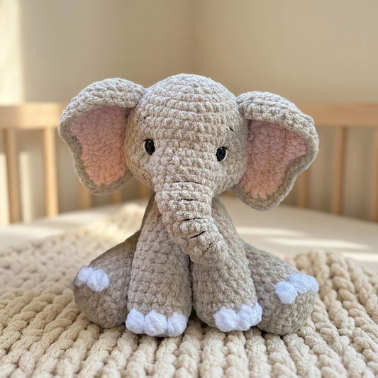 Pebble the Elephant, a crocheted amigurumi toy, in a nursery