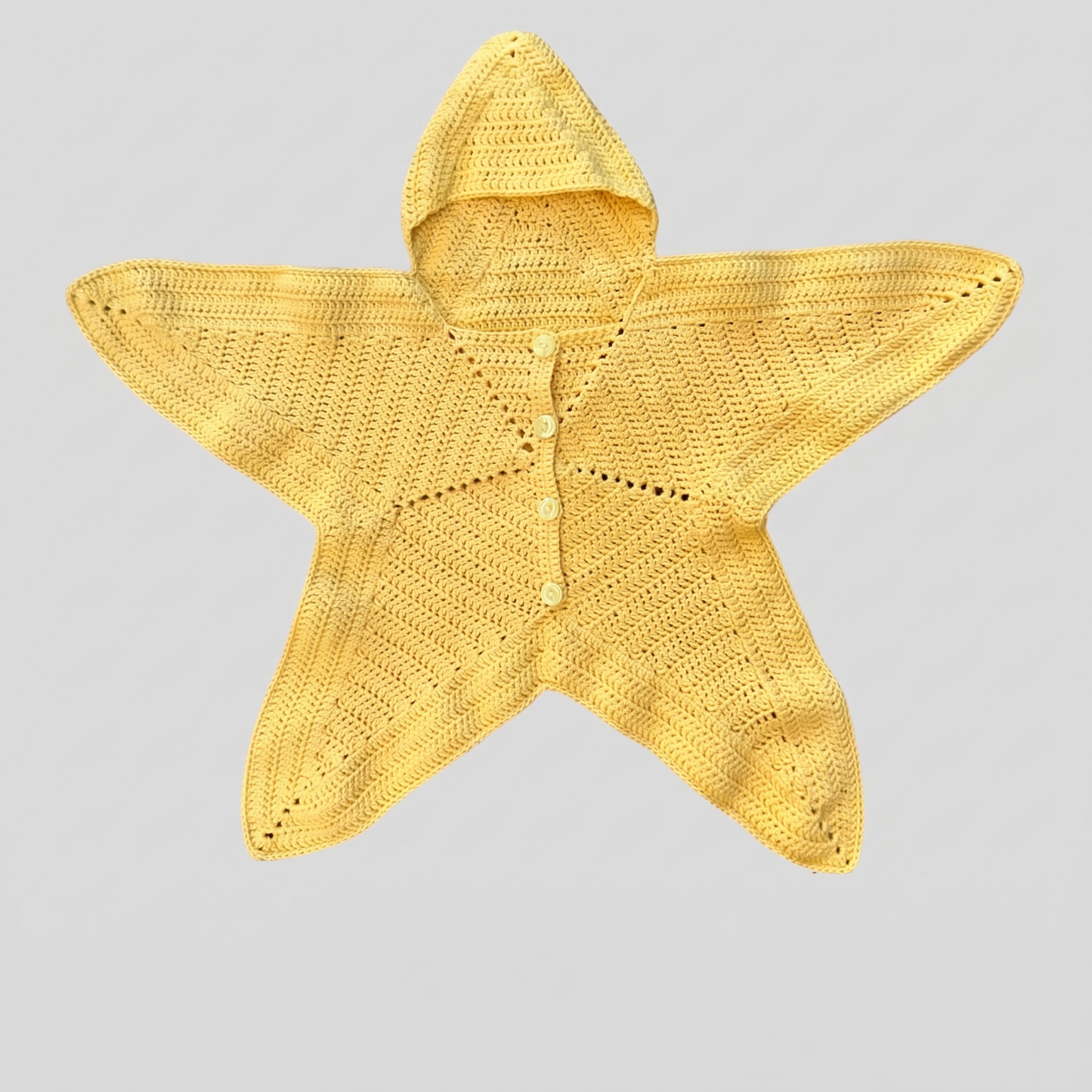 The finished Nova Star Suit laid flat — hooded five-point crochet star suit with button placket