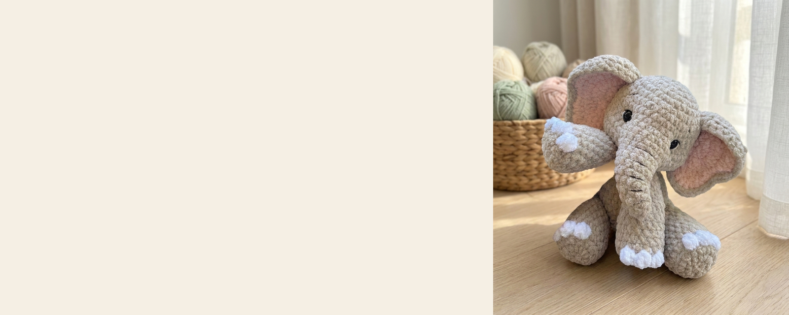 Pebble the Elephant, a crocheted amigurumi, beside a basket of yarn
